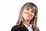 beautiful blond businesswoman holding pencil in the mouth