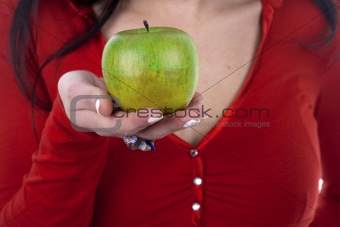 woman with red shirt holding green apple