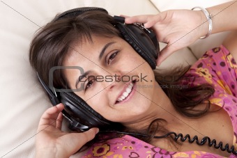 beautiful young girl with headphones listening music