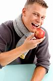smiling young man posing with apple