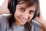 young woman listening music with headphones