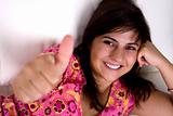 beautiful young woman smiling with thumbs up