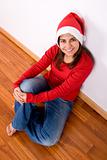 beautiful young woman with red christmas hat
