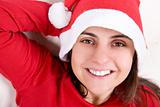 beautiful young woman with red christmas hat portrait