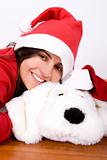 young woman playing with toy dog in christmas