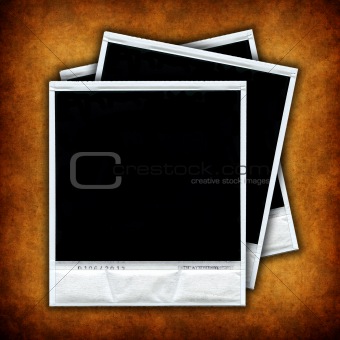 Set of three empty photo frames over grunge background