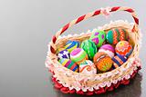 Easter egg laying inside beautiful basket