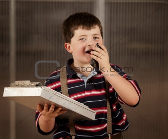 Little boy in adult clothes on cell phone