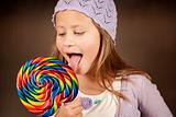Cute young girl with lollipop