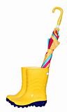 Pair of yellow rubber boots with colorful umbrella