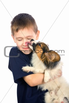 Puppy licking child face