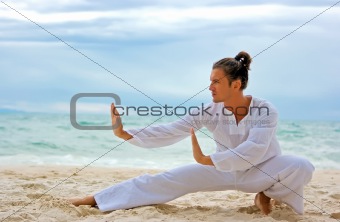 Wushu man on the beach