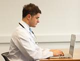 Attractive doctor working with a laptop