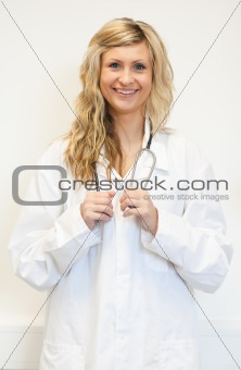 Blonde doctor looking at the camera