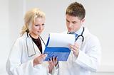 Young doctors reading a medical report