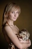 Portrait of the beautiful naked woman with furs. 