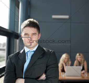 Young businessman looking at the camera