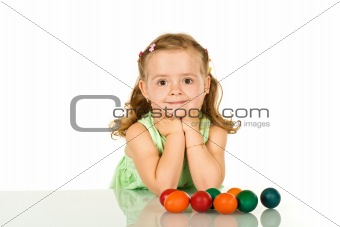 Smiling little girl with easter eggs