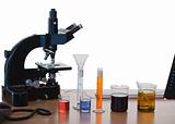 Laboratory glassware and microscope