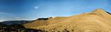 Beautiful panorama mountain landscape with golden grassland in m