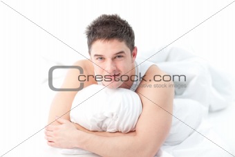 Man lying on bed awake