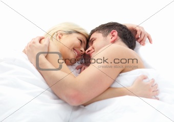 loving Couple relaxing on bed 