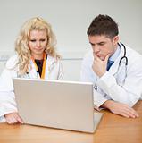 Two Doctors Woking with laptop