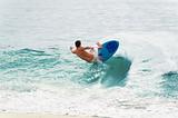 Surfer Balancing on Wave