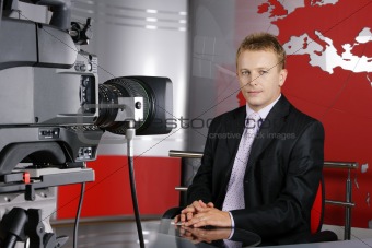 handsome middle age television news presenter