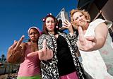 Three Trashy Women making a Rude Gesture