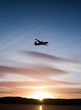 Airplane in sunset