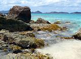 Rocky tropical beach with coral outcroppings