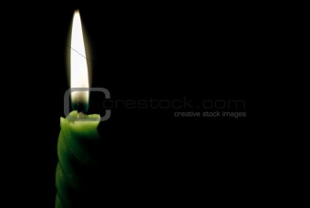 Steady candle flame in darkness