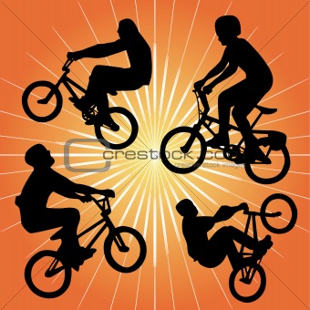silhouette of bmx riders on an orange background.