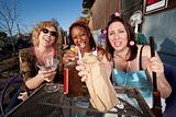Three women drinking alcohol