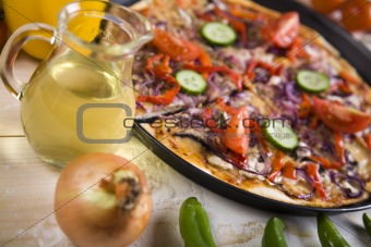 Vegetables with a pizza
