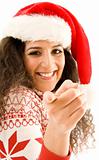 latin american model in christmas hat pointing towards