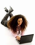 young female lying on floor working on laptop