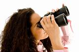 smart young businesswoman looking through binoculars