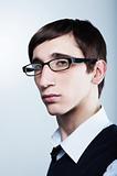 Cute young guy with fashion haircut wearing glasses