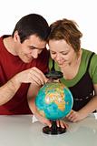 Couple looking at globe