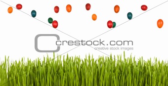 Easter egg rain over green grass