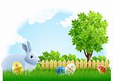 easter rabbit and eggs on the green garden grass