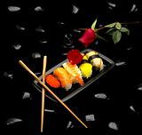 assorted sushi plate and red rose