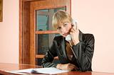 blond receptionist at phone