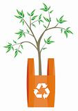 Recycling symbool in an orange shopping bag.