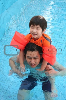 Man & boy in the swimming pool