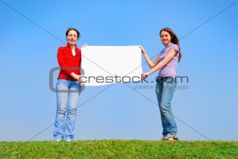 Girls holding blank sheet