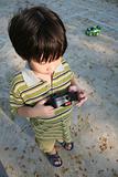 Boy playing remote control car