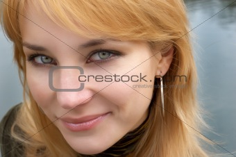 red haired girl with green eyes. soft portrait.